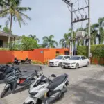 Cars and motorbikes parked at Signature Phuket Resort in Chalong